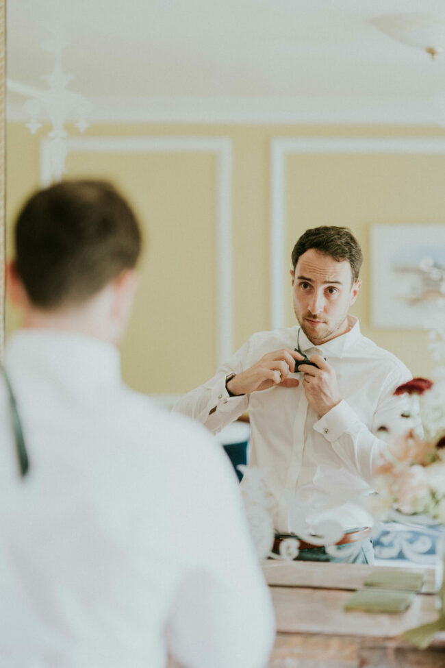 groom getting ready editorial photography